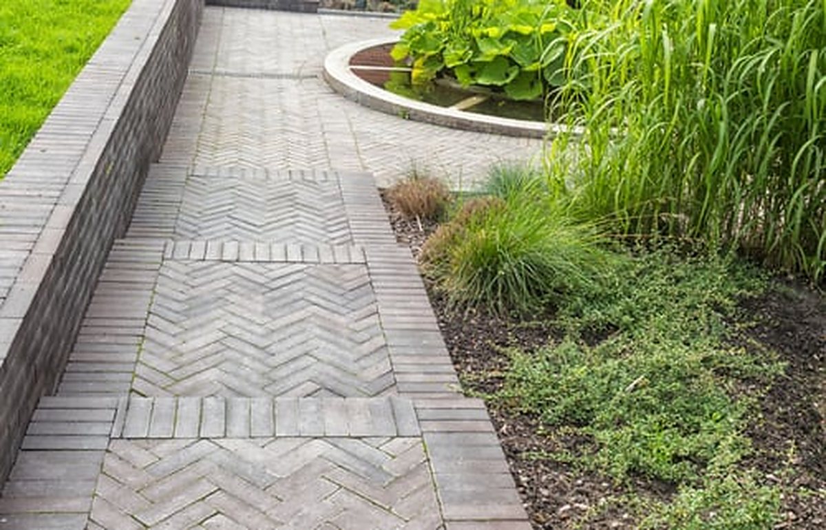 Paver walkway with planted borders